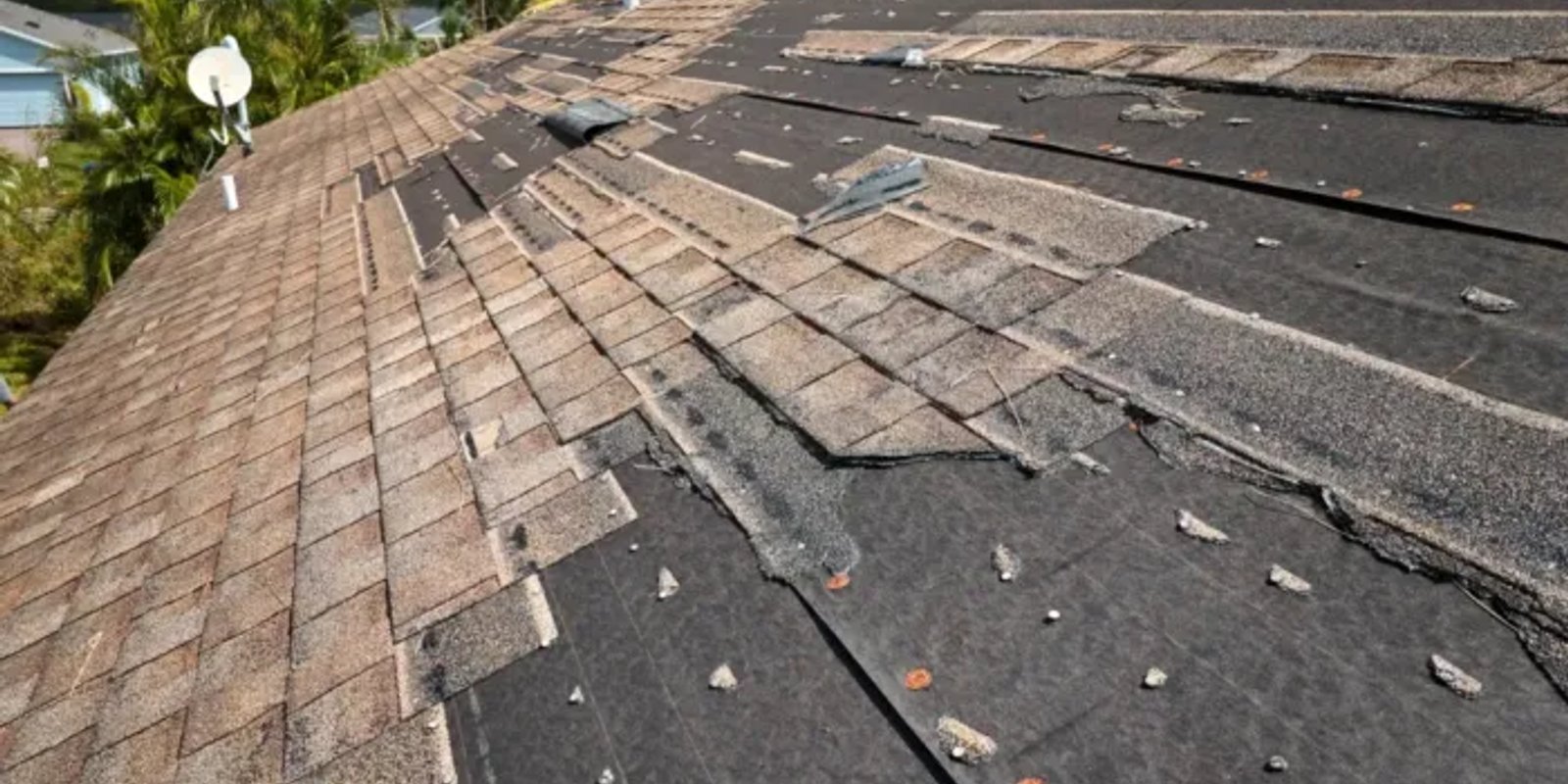 damaged shingle roof before repair