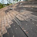 damaged shingle roof before repair