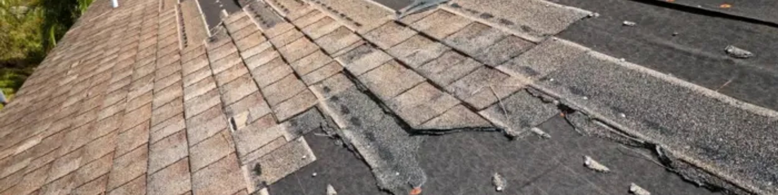 damaged shingle roof before repair