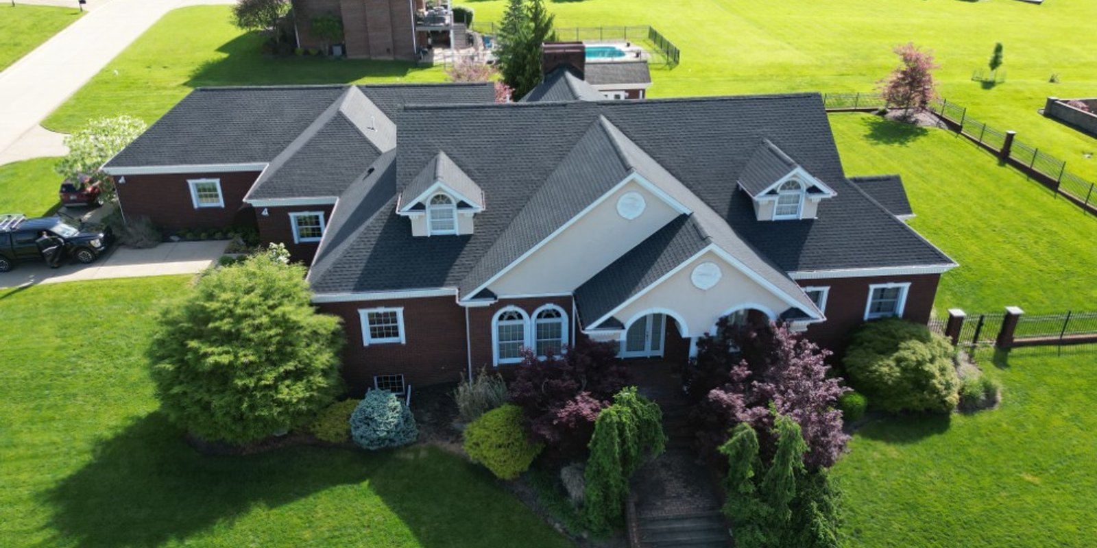Platinum Home Exteriors crew installing a shingle roof in Ohio