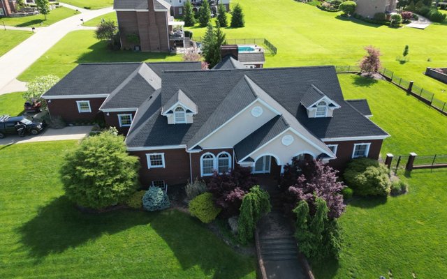 Platinum Home Exteriors crew installing a shingle roof in Ohio