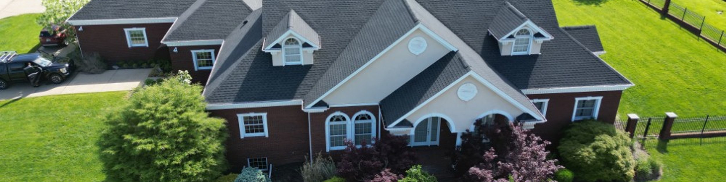 Platinum Home Exteriors crew installing a shingle roof in Ohio