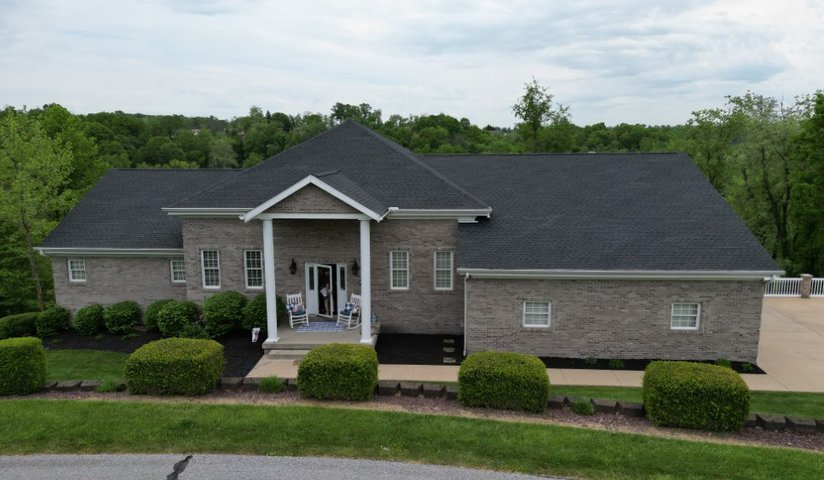 Ridge vent installed along the peak of a shingle roof by Platinum Home Exteriors