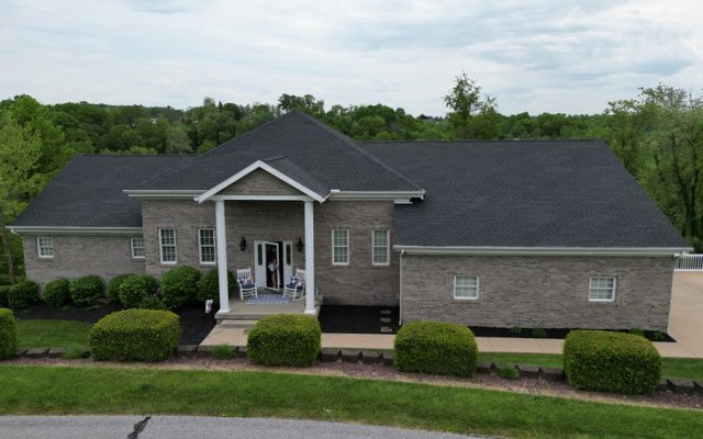Ridge vent installed along the peak of a shingle roof by Platinum Home Exteriors
