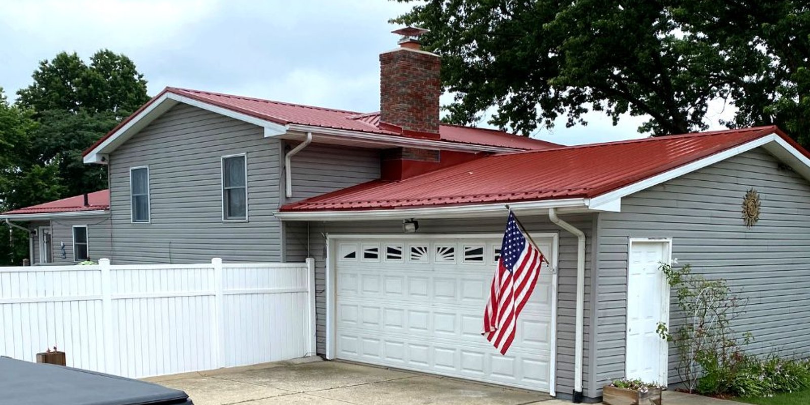 Red Metal Roof Replacement on Garage and House