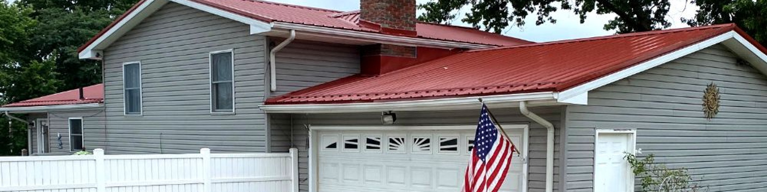 Red Metal Roof Replacement on Garage and House